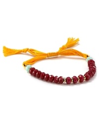 The classic friendship bracelet has officially gone glam. Shashi adds mutli-colored cord and a row of semi-precious beads for a look that's totally bright now.