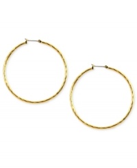 Embellished elegance. Anne Klein adds glass accents to these hoop earrings crafted from gold-tone mixed metal to stunning effect. Approximate diameter: 2 inches.