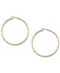 Hints of subtle texture create a look that's modern and elegant on these Jones New York hoop earrings. Crafted in gold tone mixed metal. Approximate drop: 3/4 inch.