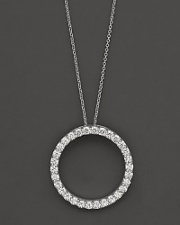 From the Tiny Treasures collection, a large, diamond circle necklace; with signature ruby accent. Designed by Roberto Coin.