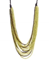 Whisk yourself away with this exotic style. Kenneth Cole New York's African-inspired necklace features multiple rows of bright lime green and brown seed beads. Set in gold-plated mixed metal and strung from brown cord. Approximate length: 22 inches + 3-inch extender. Approximate drop: 2-3/4 inches.