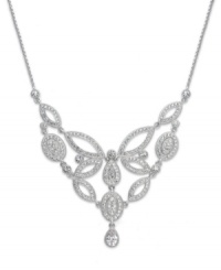 It's all in the name. Eliot Danori's Windsor frontal necklace epitomizes elegance with its decadent setting adorned with sparkling cubic zirconias (3/4 ct. t.w.) and crystals. Set in rhodium-plated mixed metal. Approximate length: 16 inches + 2-inch extender. Approximate drop: 1-1/2 inches.