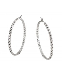 Get all tied up in traditional style with a modern twist. BCBGeneration adds a little extra flair to the classic hoop earring with a unique rope pattern. Crafted in oxidized silver tone mixed metal. Approximate diameter: 1-1/2 inches.