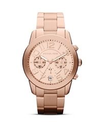 Get it right office or off duty with this handsome Michael Kors watch, which crafts a sophisticated statement with its rose gold plated dial and matching link bracelet.