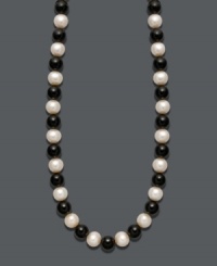 Show your true stripes with stylish, contrasting colors. Necklace features a chic strand of bold onyx beads (85 ct. t.w.) and cultured freshwater pearls (8-9 mm). Clasp crafted in 14k gold. Approximate length: 18 inches.