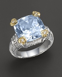 Faceted blue crystal stone ring is offset by four heart-shaped diamond accents set in 18 Kt. gold. Textured sterling silver band. Designed by Judith Ripka.