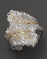 An oak leaf is detailed in 18K yellow gold accents on Buccellati's nature-inspired cuff bracelet.