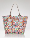 LeSportsac dresses up it's tried and true nylon tote in a bolder is better print. Carry it for effortless on-the-go style.