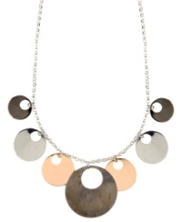 Out of this world. Striking cut-out circles create a unique orbital design on Nine West's shaky necklace. Set in silver, rose gold, and hematite-plated mixed metal. Approximate length: 17 inches + 2-inch extender. Approximate drop: 1-1/2 inches.