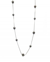 Alfani's long station necklace is sure to be a diverse, dramatic look within your jewelry collection. Crafted in hematite tone mixed metal. Approximate length: 42 inches.