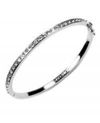 Polished and sleek. Givenchy's rhodium-plated silver tone bracelet features crystal glass stone detailing. Approximate diameter: 2-1/2 inches.