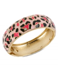 Heed the call of the wild with this hinged bangle bracelet from Betsey Johnson. Crafted from gold-tone mixed metal, a leopard print and glass crystal accents give this an edgy fashion infusion. Approximate diameter: 2-3/8 inches.