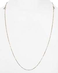 Small beaded stations dot a long, sterling silver chain from Links of London.