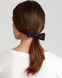 Tie up your look with this nouveau-retro Juicy Couture hair bow, in a dark leopard print punched up with black studs.