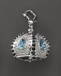 Inspired by Zen philosophy, this polished sterling silver Raja meditation bell from Paul Morelli is set with blue topaz and black spinel.