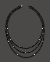 Faceted black sapphires, punctuated by diamonds, form three dazzling strands. By Roberto Coin.