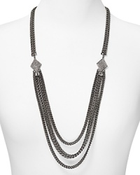 Styled for cool confidence, this Rebecca Minkoff necklace brings the brand's downtown glamour to the jewel box with its rough cut gunmetal chain and splash of glass stones.