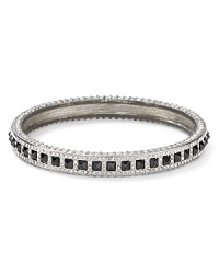 Oh so flipped out, this Rebecca Minkoff bangle works a decidedly downtown vibe, crafted of silver plated metal.