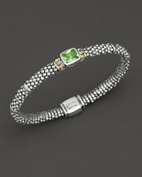 From the Glacier collection, thin caviar rope bracelet with centered peridot stone and gold accents. Designed by Lagos.