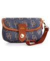 Laid-back denim gets an instant upgrade in graphic, signature DB pattern and supple leather trim. This adorable Dooney & Bourke wristlet is perfectly proportioned to stow keys, cash, cards and ID. Detachable strap transforms the design into a mini clutch that discretely slips inside almost any purse.