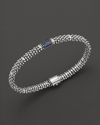 Bead-textured bracelet from Lagos in sterling silver, accented with blue sapphire.