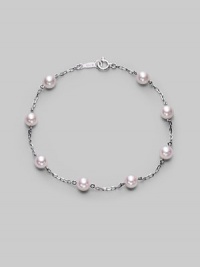 From the Akoya Collection. A delicate chain, sprinkled with lustrous white cultured Akoya pearls. 5mm white, round cultured pearls Quality: A+ 18k white gold Length, about 7 Spring ring clasp Imported