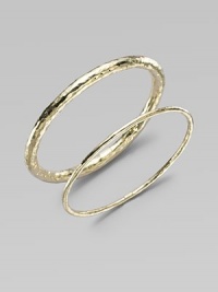 A simple, sophisticated, substantial bangle of 18k yellow gold with a rich hammered texture. 18k yellow gold Diameter, about 2½ Imported Please note: Bracelets sold separately.