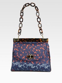 A charming floral print canvas style accented with glossy resin and radiant hardware.Chain shoulder strap, 8 dropMagnetic snap flap closureOne zip and two open inner compartmentsOne inside zip pocketTwo inside open pocketsCotton lining11W X 9½H X 3DImported