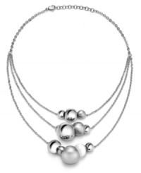 The possibilities are endless. Breil's chic stainless steel necklace can be worn in a variety of ways -- as a clustered statement necklace, as a subtle illusion necklace, or as a trendy station necklace. Polished and satin finish spheres and a white natural stone are easily moved to create the look of your choice. Approximate length: 18 inches.