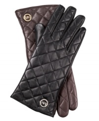 Join the quilted crowd with these luxe, leather gloves from MICHAEL Michael Kors. Chic signature-embossed  detailing adds a touch of elegance, for a look that's altogether exquisite.