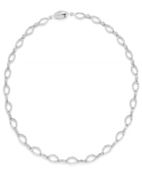 Shape up with a little shimmer. Eliot Danori's intricate oval link necklace glistens with the addition of round-cut crystals. Set in silver tone mixed metal. Approximate length: 16 inches.