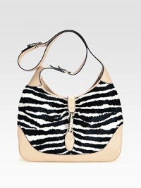 Lush zebra-striped haircalf pairs with rich leather in a roomy carryall.Adjustable and detachable shoulder strap, 8¾-19¾ dropPiston clasp closureOne inside zip pocketOne cell phone pocketOne PDA pocketLinen lining13W X 8¾H X 2¾DMade in Italy of imported fabric