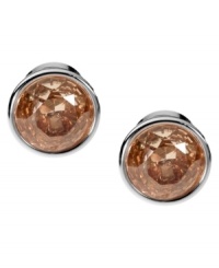 Smoky hues captivate the senses. Michael Kors' elegant stud earrings boast round-cut smoky topaz-colored cubic zirconia set in silver tone mixed metal. Approximate diameter: 1/2 inch.