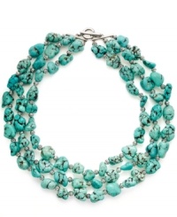 A taste of summer. Three rows of semi-precious turquoise nuggets in varying sizes adorn this pool-blue necklace from Lauren by Ralph Lauren. Toggle closure and accents crafted in silver tone mixed metal. Approximate length: 18, 19 and 20 inches.