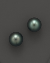 Naturally colored, cultured Tahitian black pearls make a statement on delicate stud earrings. From Tara Pearls.