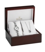 Sweeping loops of crystal dance across the lovely watch and necklace of this box set by Bulova.