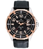 Bulova defines luxury with this Marine Star collection watch. Black croc-embossed leather strap and round stainless steel case with rose-gold tone accents at bezel. Textured black dial features applied rose-gold tone numerals, stick indices, date window at three o'clock, three luminous hands and logo. Quartz movement. Water resistant to 100 meters. Three-year limited warranty.