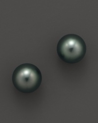 Naturally colored, cultured Tahitian black pearls make a statement on delicate stud earrings. From Tara Pearls.