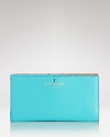 Here's a cute idea: carry all of your nearest-and-dearest essentials in this kate spade new york leather wallet, which features 12 credit card slots.