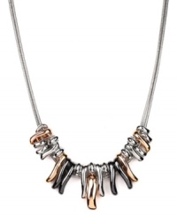 Raise the bar. Nine West's trendy necklace combines graduated bars of silver, rose gold and hematite tone mixed metal on a doubled snake chain. Approximate length: 16 inches + 2-inch extender. Approximate drop length: 3/4 inch. Approximate drop width: 2-3/4 inches.