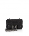 THE LOOKCrossbody chainPetite rectangular silhouetteJet black crystals alloverOversized crystal turnlock closureOne inside open pocketInside logo detailTHE MEASUREMENTCrossbody chain, 17 drop5W X 3H X 2DTHE MATERIALCrystalsSatinViscose/silk liningORIGINMade in Italy