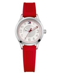 Creative and contemporary, this watch by Tommy Hilfiger keeps things interesting. Red textured silicone strap and round stainless steel case. Double-layered white and silver tone dial features cut-out numerals, red minute track, flag logo at twelve o'clock and three hands with red accents. Quartz movement. Water resistant to 30 meters. Ten-year limited warranty.