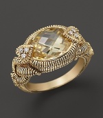 Oval canary crystal stone accented with heart-shaped diamond prongs and textured band in 18K gold. By Judith Ripka.