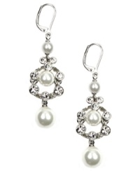 The perfect complement to the perfect dress. These diminutive, yet dazzling bridal earrings by Givenchy provide just the right amount of subtle shine with glass pearls and white glass accents. Setting and lever back crafted in silver-plated mixed metal. Approximate drop: 2-1/4 inches.