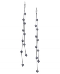 Fire up your evening with these two-row linear earrings from GUESS. Crystal-embellished fireballs hang from metal chains. Crafted in imitation rhodium tone mixed metal. Approximate drop: 7 inches.