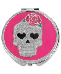 It's enough to make up the dead. This pink compact from Betsey Johnson is crafted from silver-tone mixed metal with a glittering skull on top, adorned with fuchsia and rose-colored accents. Item comes packaged in a signature Betsey Johnson Gift Box. Approximate length: 3 inches. Approximate width: 3 inches.