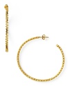 18-karat gold hoops from Gorgana are a jewel box staple. This pair boasts edgy, textured detailing to take you downtown in the most elegant way.