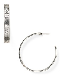 With worldly engravings, Low Luv by Erin Wasson's Afghani hoops lend a cultured look.