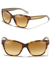 The cat eye is back--embrace the trend with Burberry. These endlessly chic sunglasses feature the brand's signature check engraved at the sides.