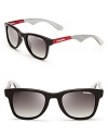 Sporty chic, these Carrera sunglasses race to the fashion finish line with matte back frames and striking red accents.